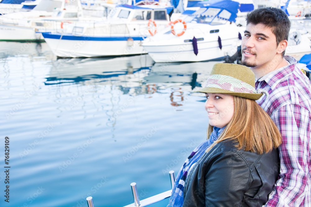 Young woman and young man on a marina Young woman and young man on a marina