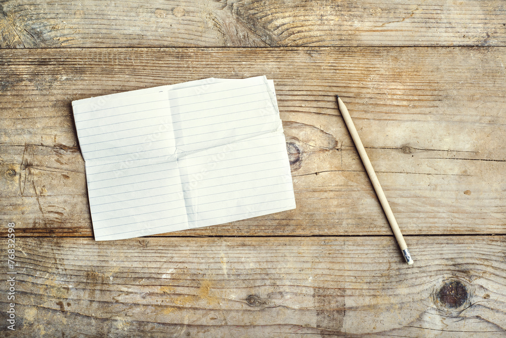 Sheet of paper on a wooden floor. Sheet of paper on a wooden floor.