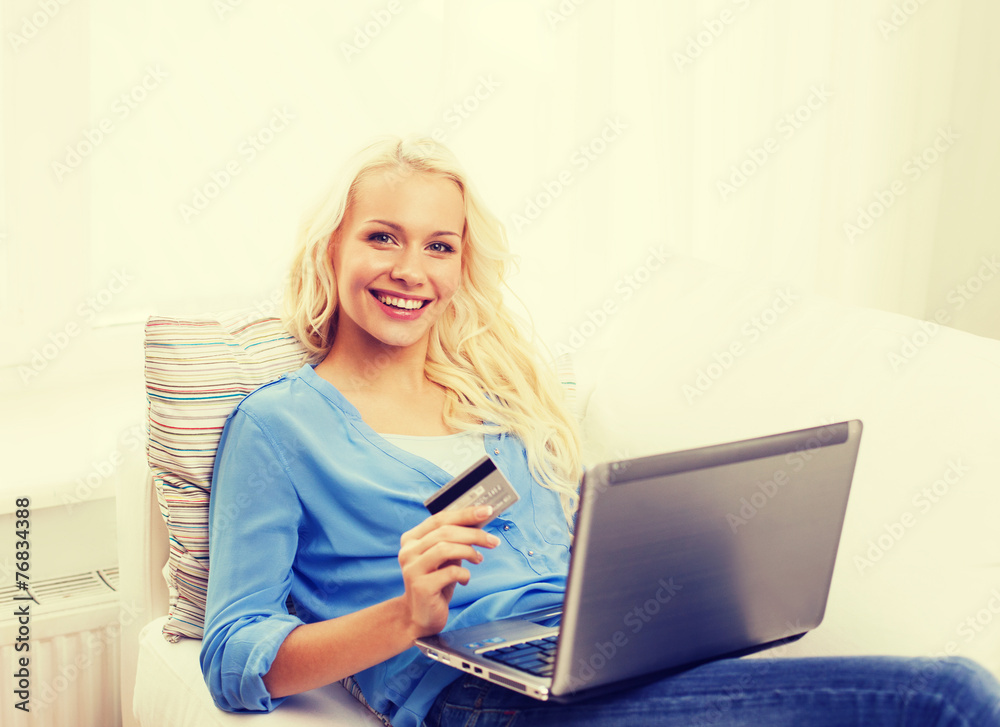 smiling woman with laptop computer and credit card smiling woman with laptop computer and credit card