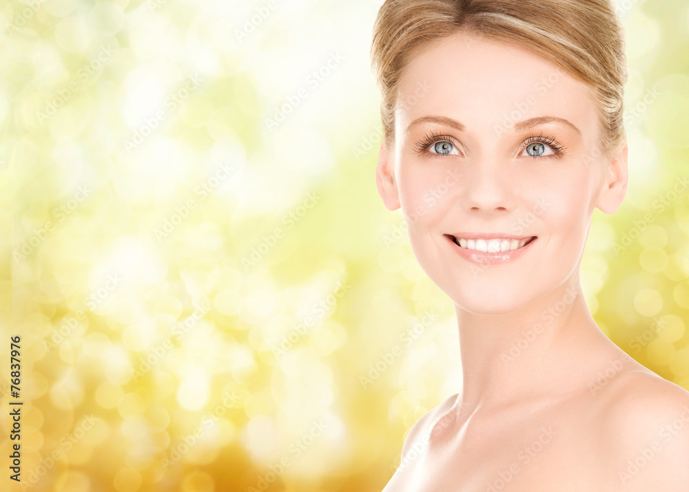 close up of smiling woman over yellow background close up of smiling woman over yellow background