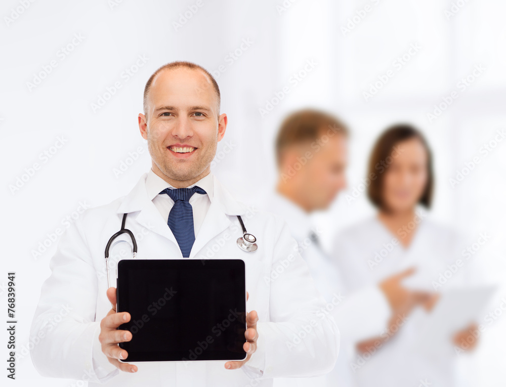 smiling male doctor with stethoscope and tablet pc smiling male doctor with stethoscope and tablet pc