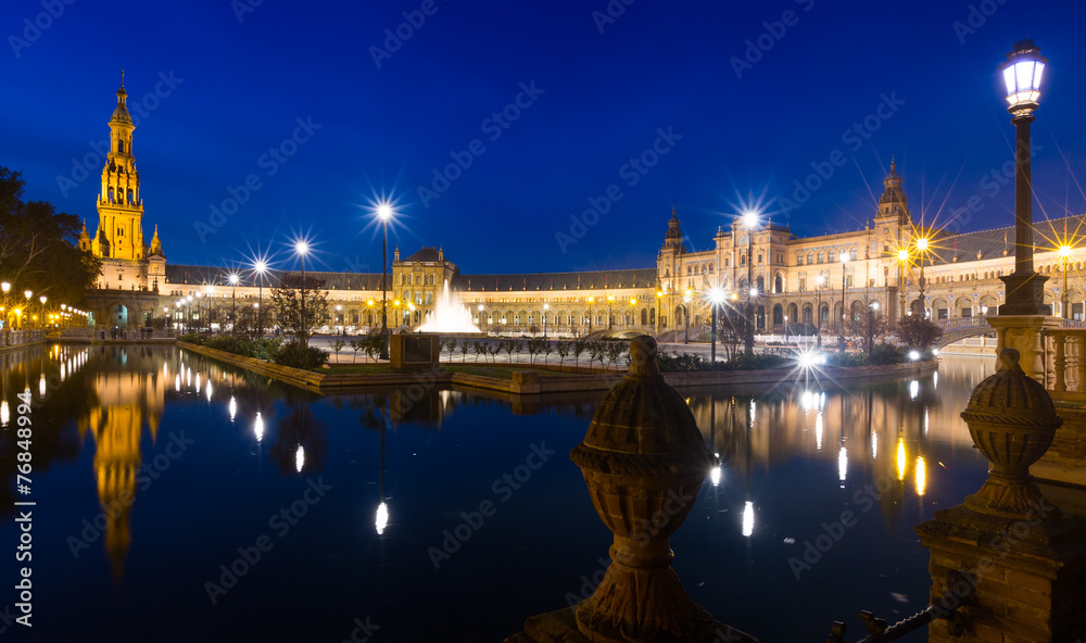 night view of Plaza de Espana with reflections