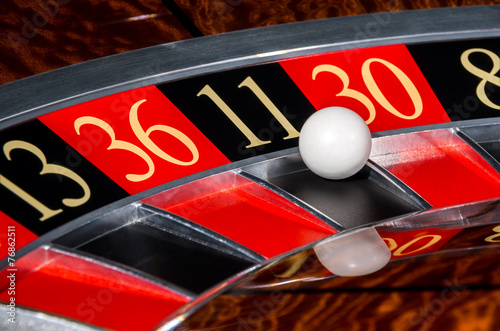 Classic casino roulette wheel with black sector eleven 11 photo