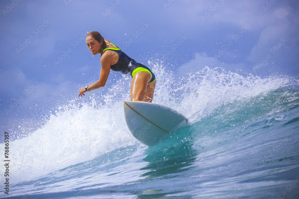 Surfer girl on Amazing Blue Wave