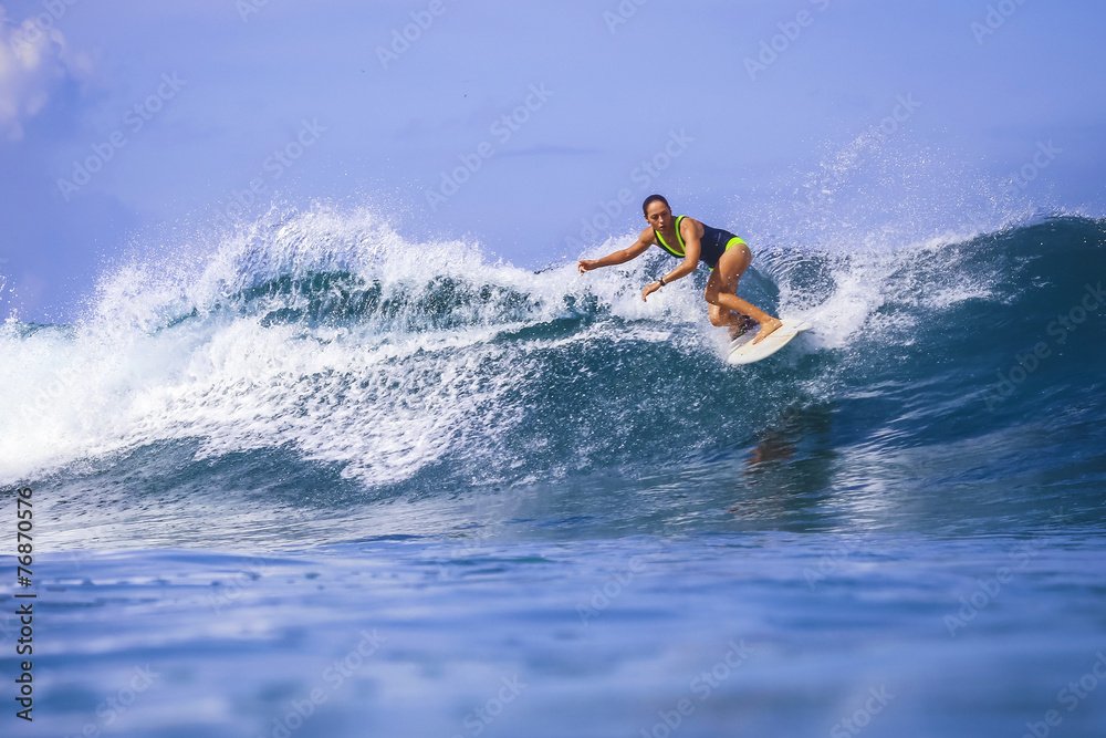 Surfer girl on Amazing Blue Wave