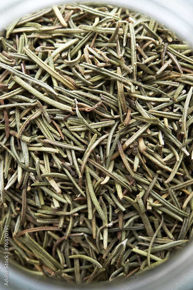 Dried rosemary on bottle,top view,close up Dried rosemary on bottle,top view,close up