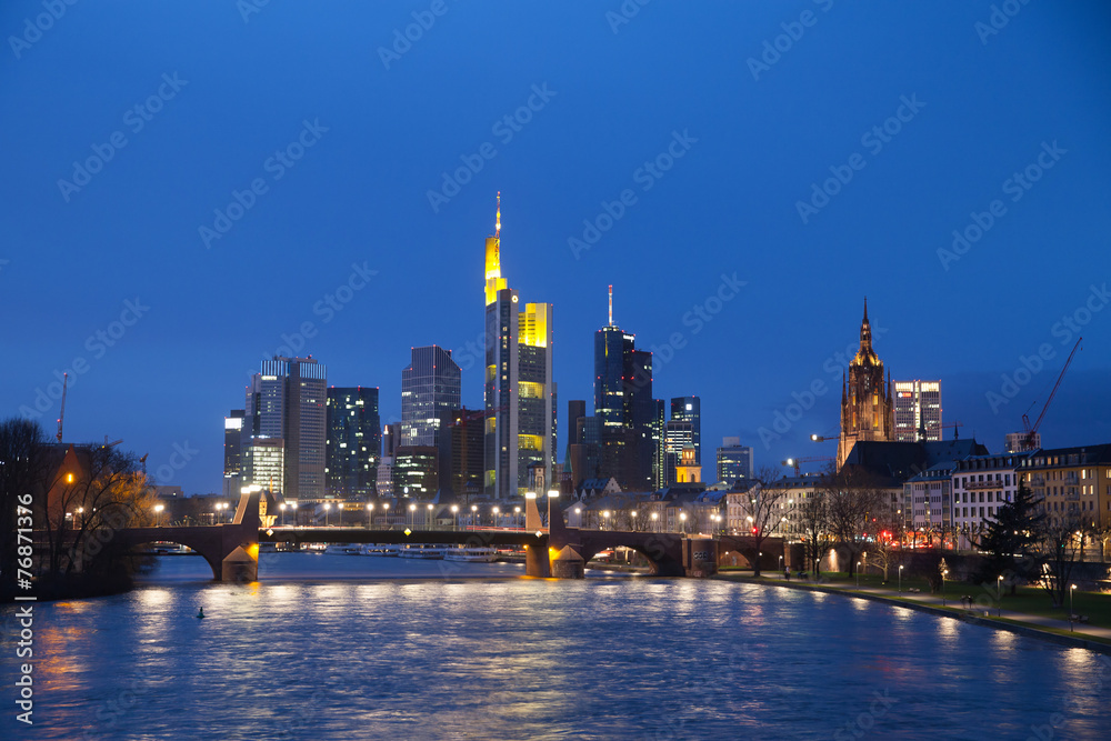 The view of Frankfurt's skyscrapers at dusk time from bridge