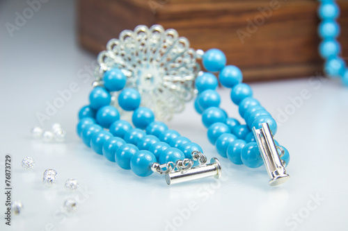 Swarowski Blue Bracelet with white crystal flower photo