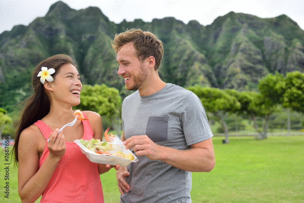 Hawaii food travel couple eating shrimps on Oahu Hawaii food travel couple eating shrimps on Oahu