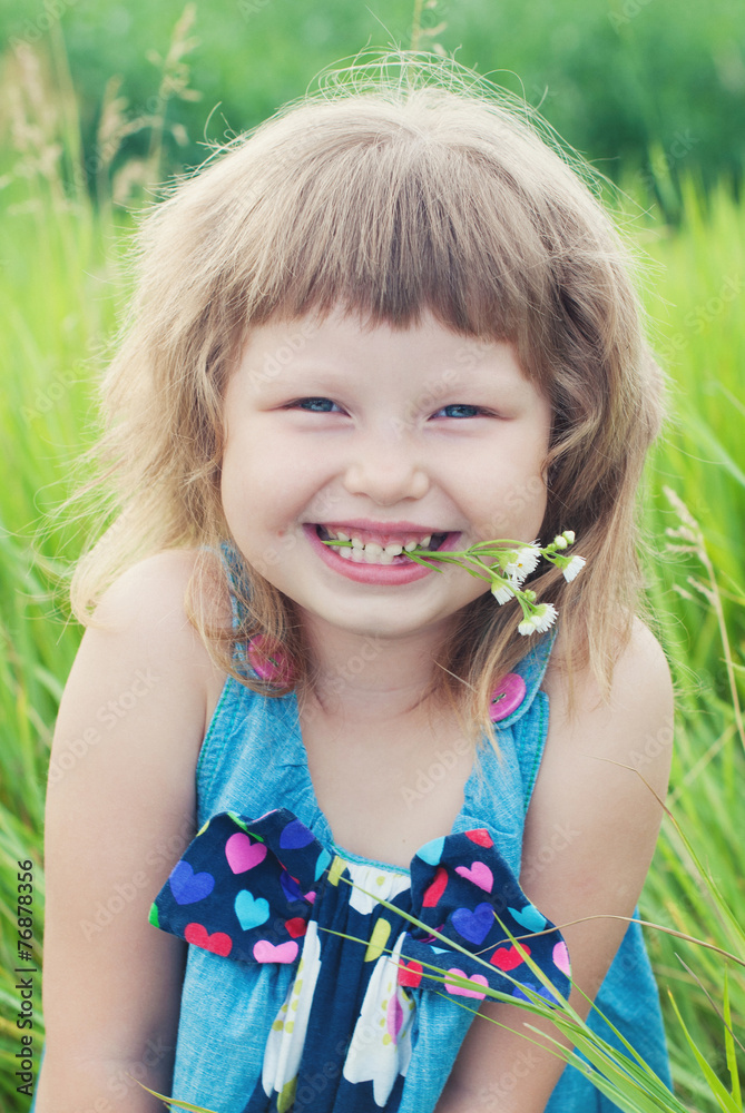 Happy Child Girl in green grass at Summer. Healthy Lifestyle. Happy Child Girl in green grass at Summer. Healthy Lifestyle.