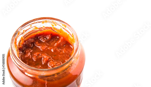 Spaghetti sauce in a jar over white background
