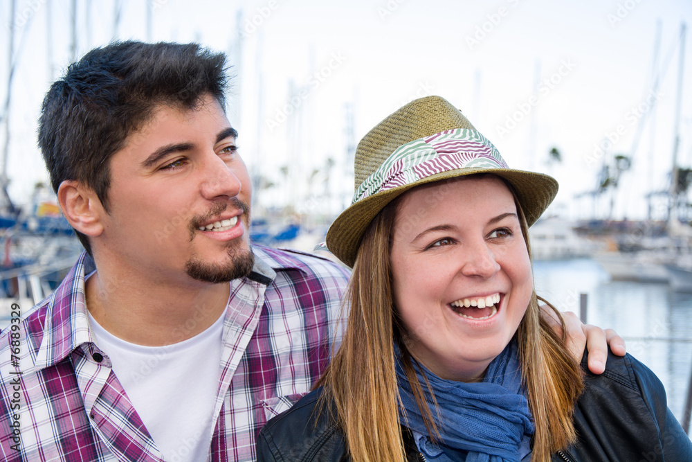 Young woman and young man on a marina