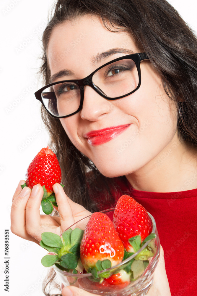 Funny woman with eyeglasses eating strawberries Funny woman with eyeglasses eating strawberries