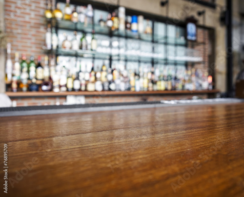 Top wooden table with Bar Blur Background