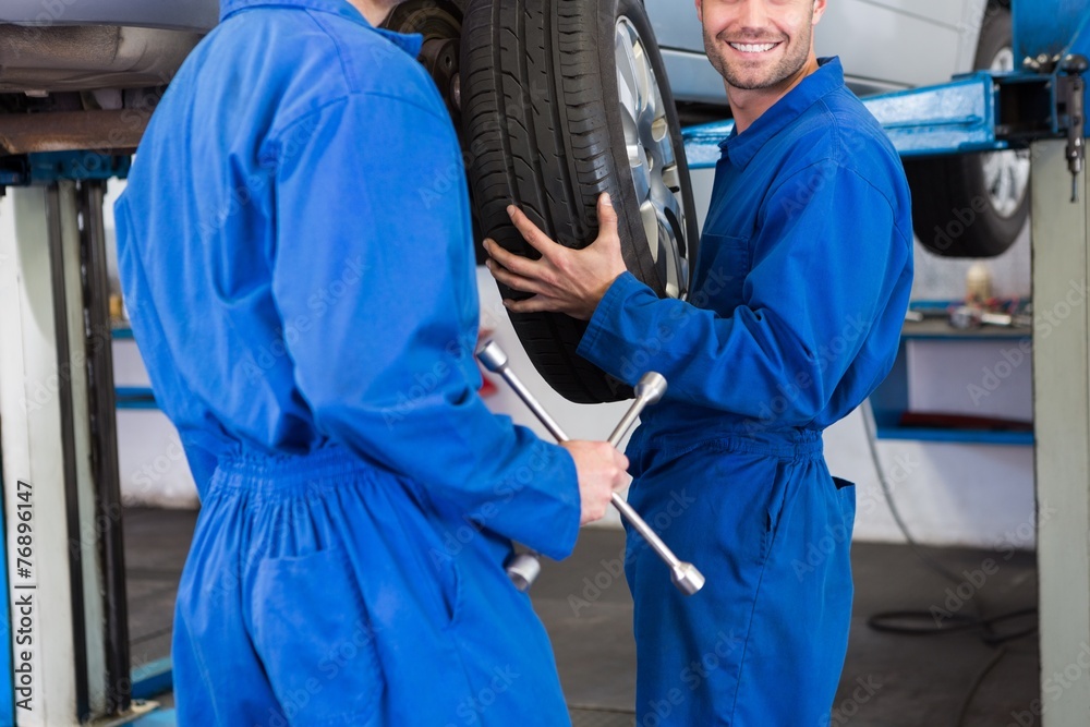Team of mechanics working together Team of mechanics working together