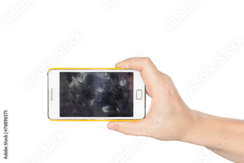 Hand holding white smartphone with fingerprint dirty screen