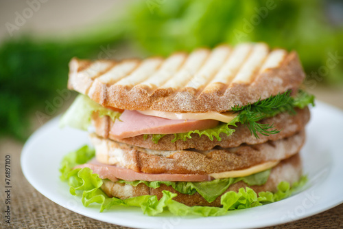 sandwich with sausage, cheese and herbs