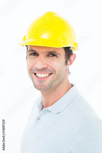 Male architect smiling over white background