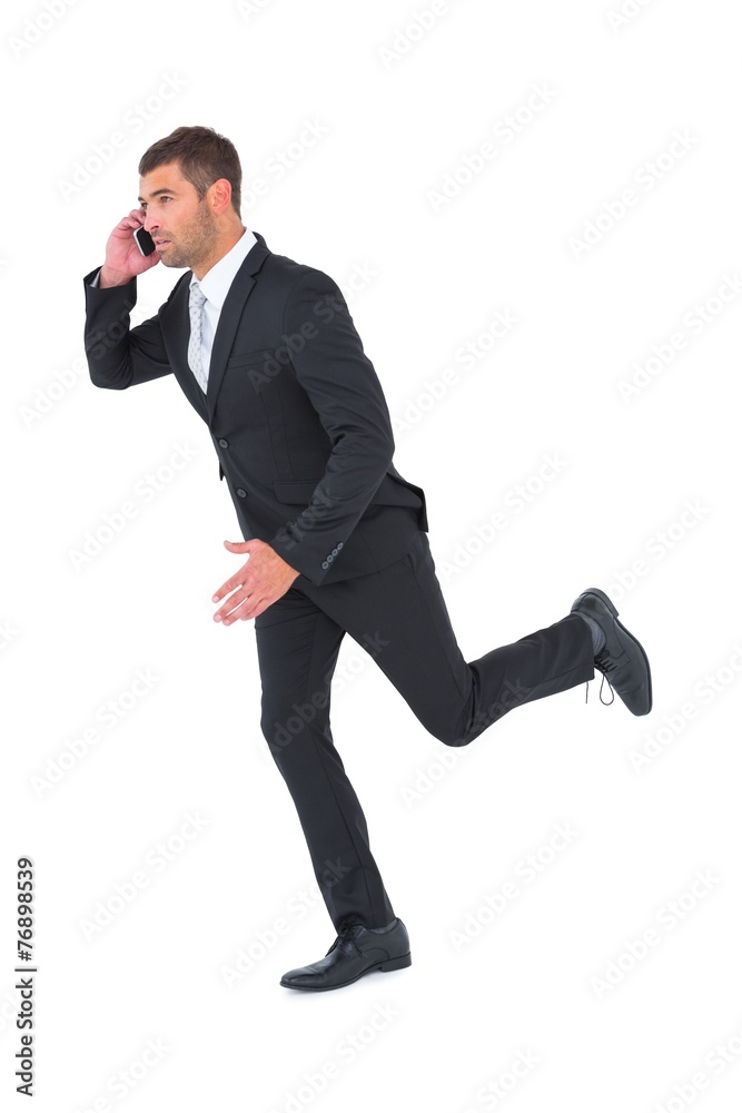Businessman running on the phone Businessman running on the phone