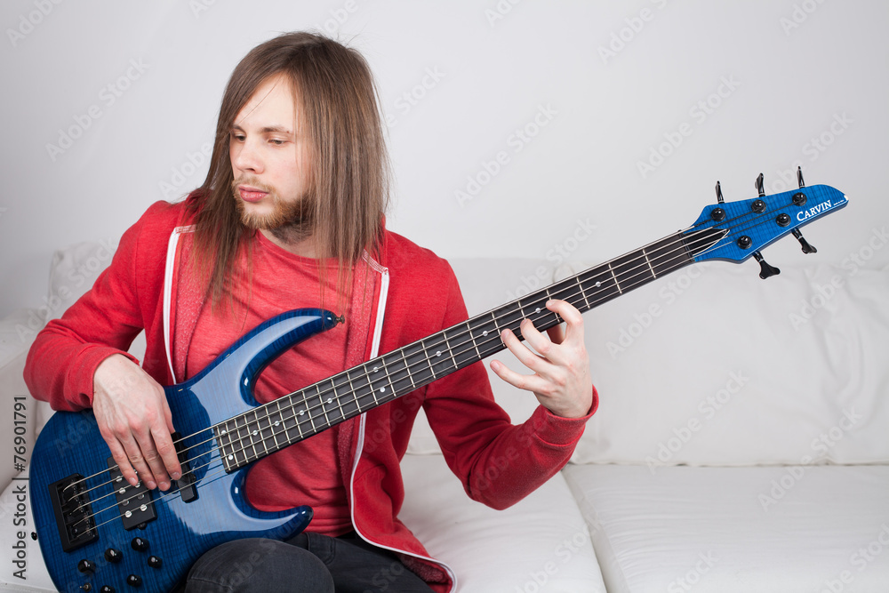 young guitarist playing guitar at home young guitarist playing guitar at home
