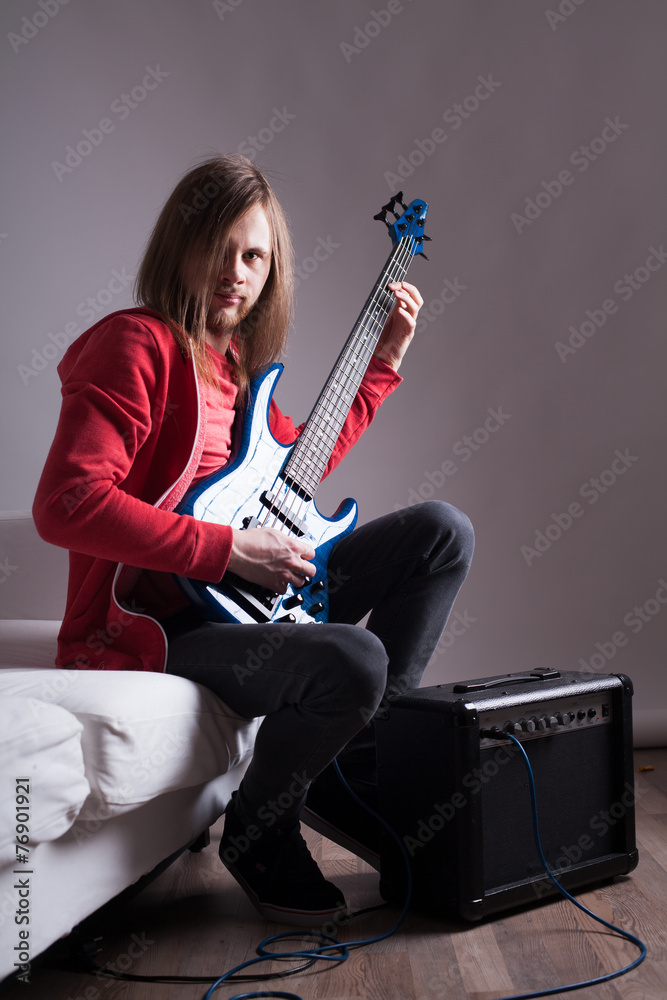 young guitarist playing guitar at home young guitarist playing guitar at home