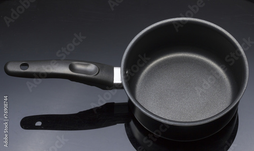Obraz na płótnie Black Handle Teflon Pot with Black background
