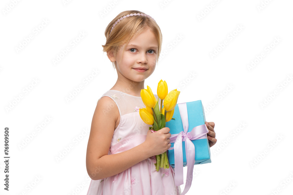 Little girl holding bouquet of yellow tulips and blue present Little girl holding bouquet of yellow tulips and blue present