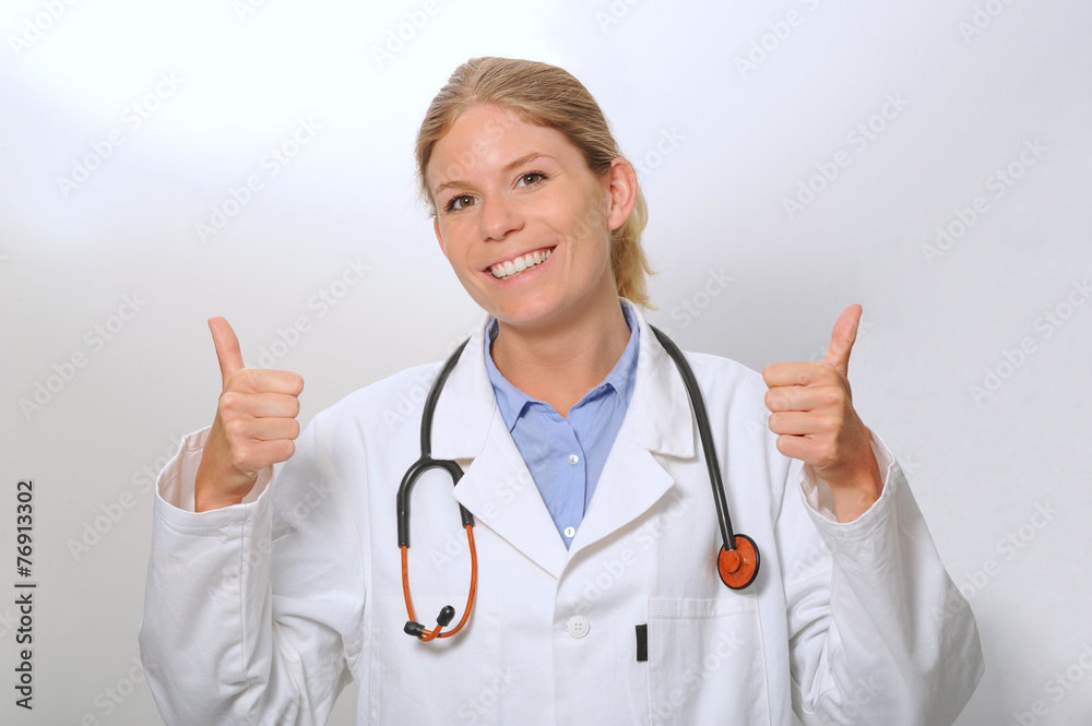 Smiling woman doctor closeup with thumbs up Smiling woman doctor closeup with thumbs up