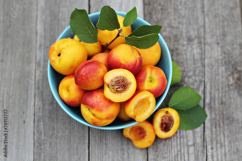 Fresh peaches in blue bowl