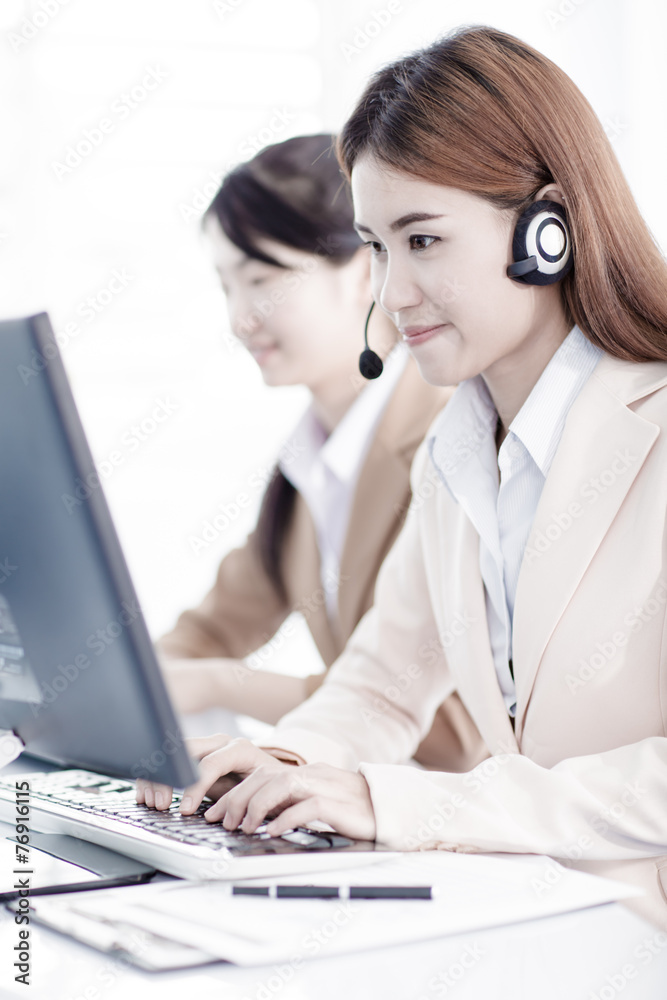 Asian women call center with phone headset Asian women call center with phone headset