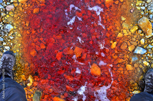 Red polluted water stream in Geamana, Romania