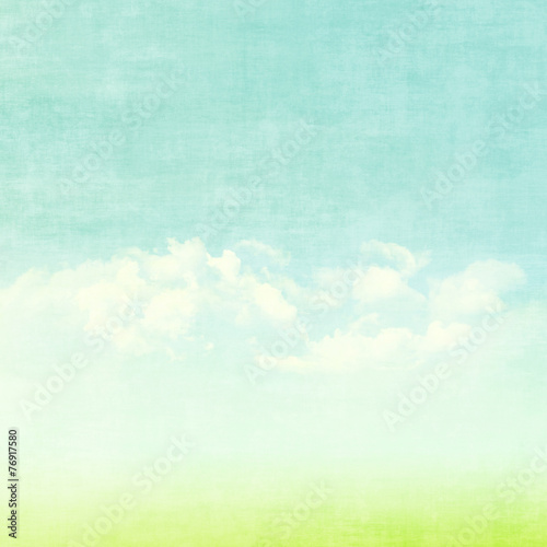 Blue sky, clouds and green field summer background