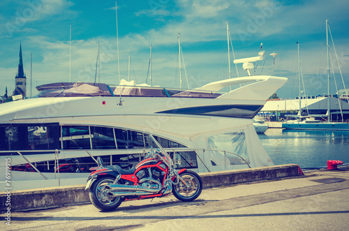 Beautiful bike on the pier on the background of yachts. Cross