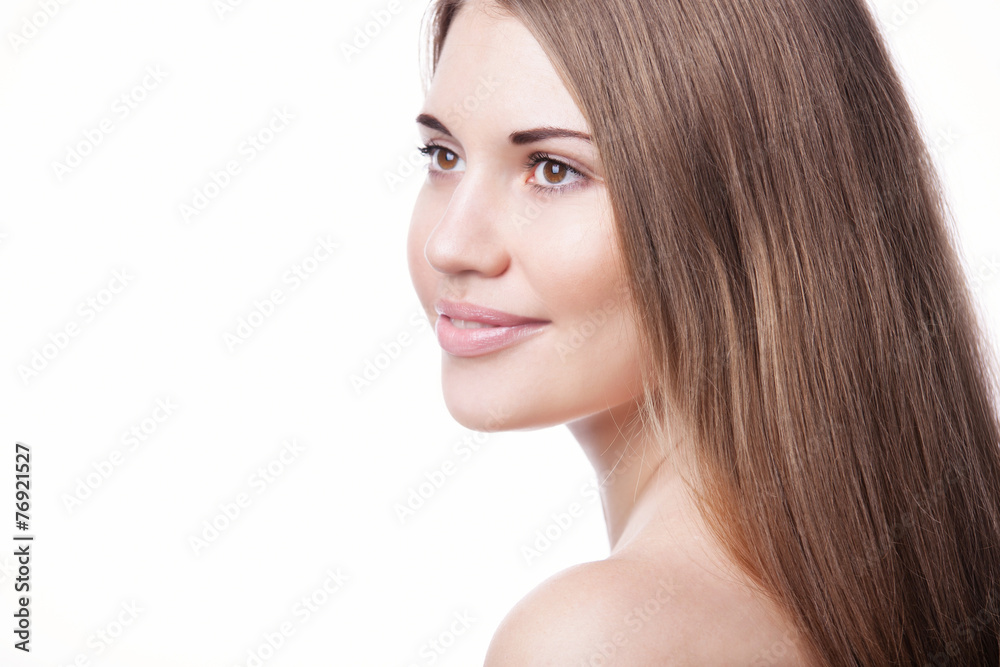 Naklejka premium beautiful woman with perfect skin and hair on a white background