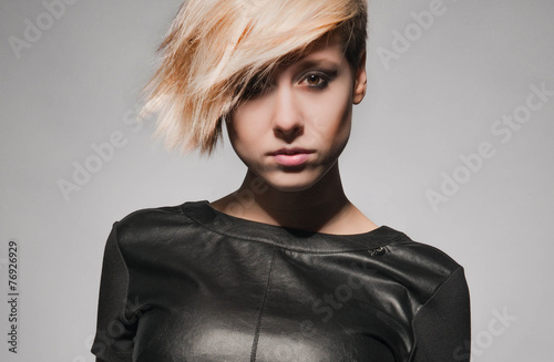 Wallpaper Mural Blonde girl with a short stylish haircut on a dark background  Torontodigital.ca