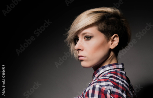Wallpaper Mural Blonde girl with a short stylish haircut on a dark background  Torontodigital.ca