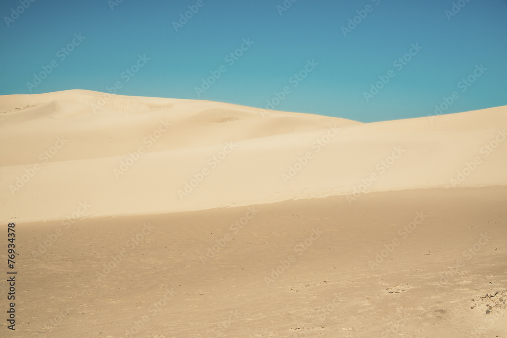 Abstract big sand dunes with clear blue sky. Port Alfred. Easter - obrazy, fototapety, plakaty 