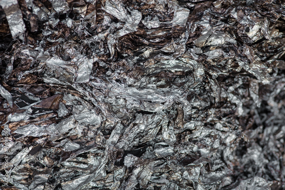Wrinkled and charred aluminum foil