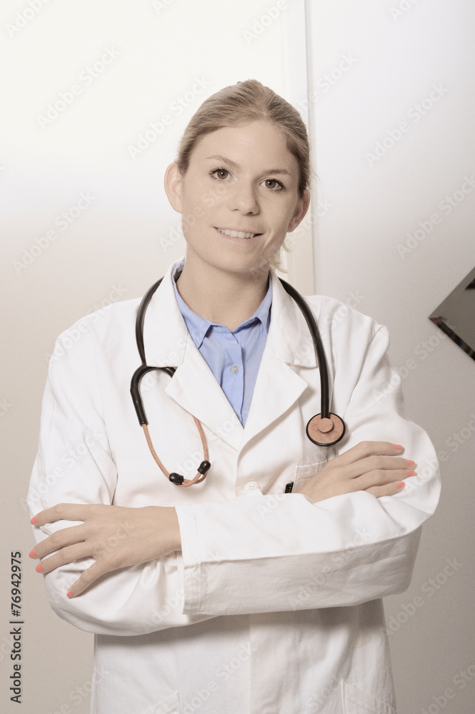 Smiling woman doctor closeup with arms crossed Smiling woman doctor closeup with arms crossed