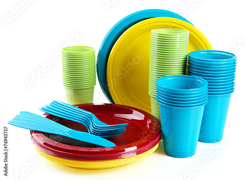 Bright plastic disposable tableware isolated on white