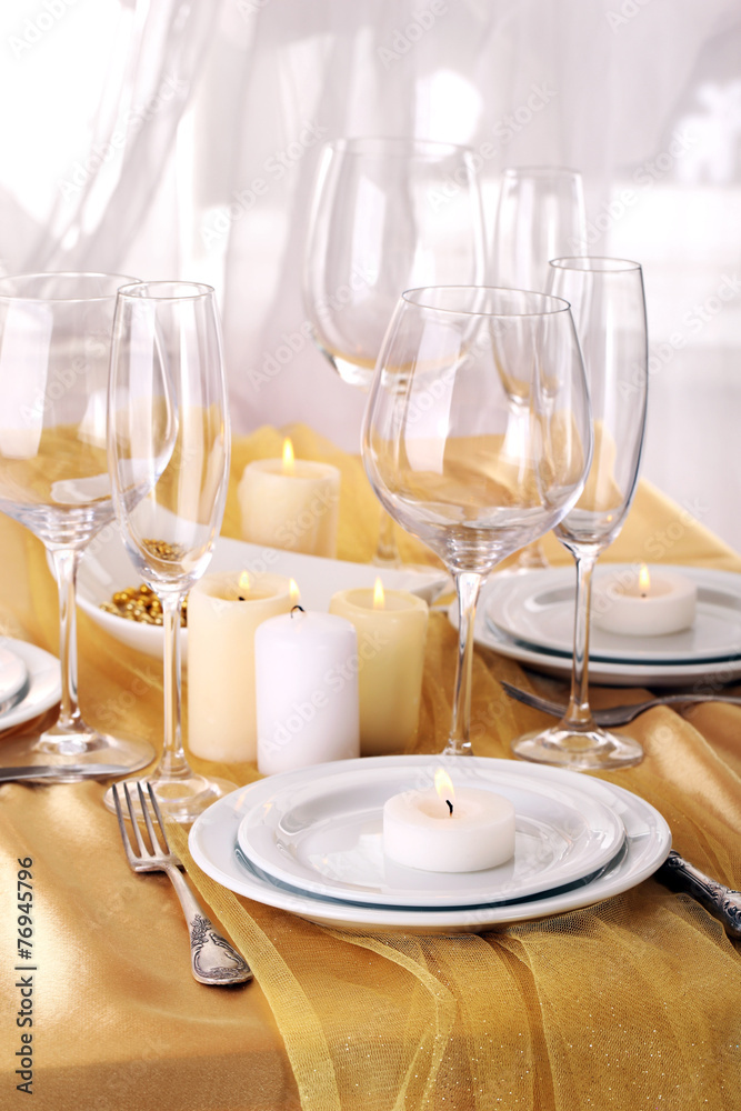 Beautiful holiday table setting in white and gold color Beautiful holiday table setting in white and gold color