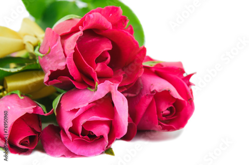 Red roses and yellow ribbons isolated on white background.