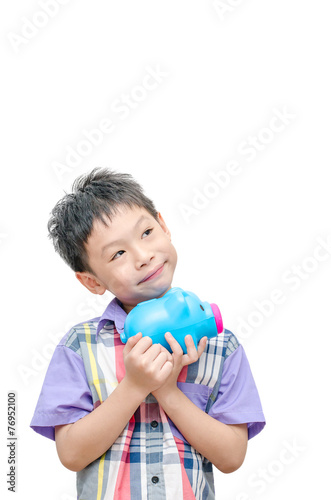 Asian smiling boy with piggy bank isolated on white