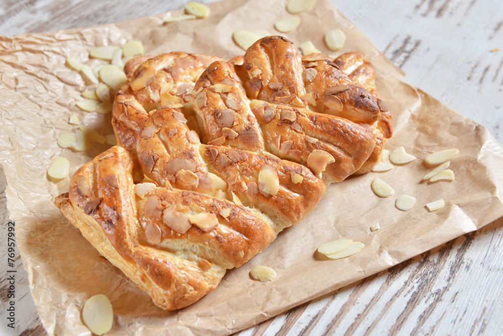Homemade rolls with almonds petals Homemade rolls with almonds petals