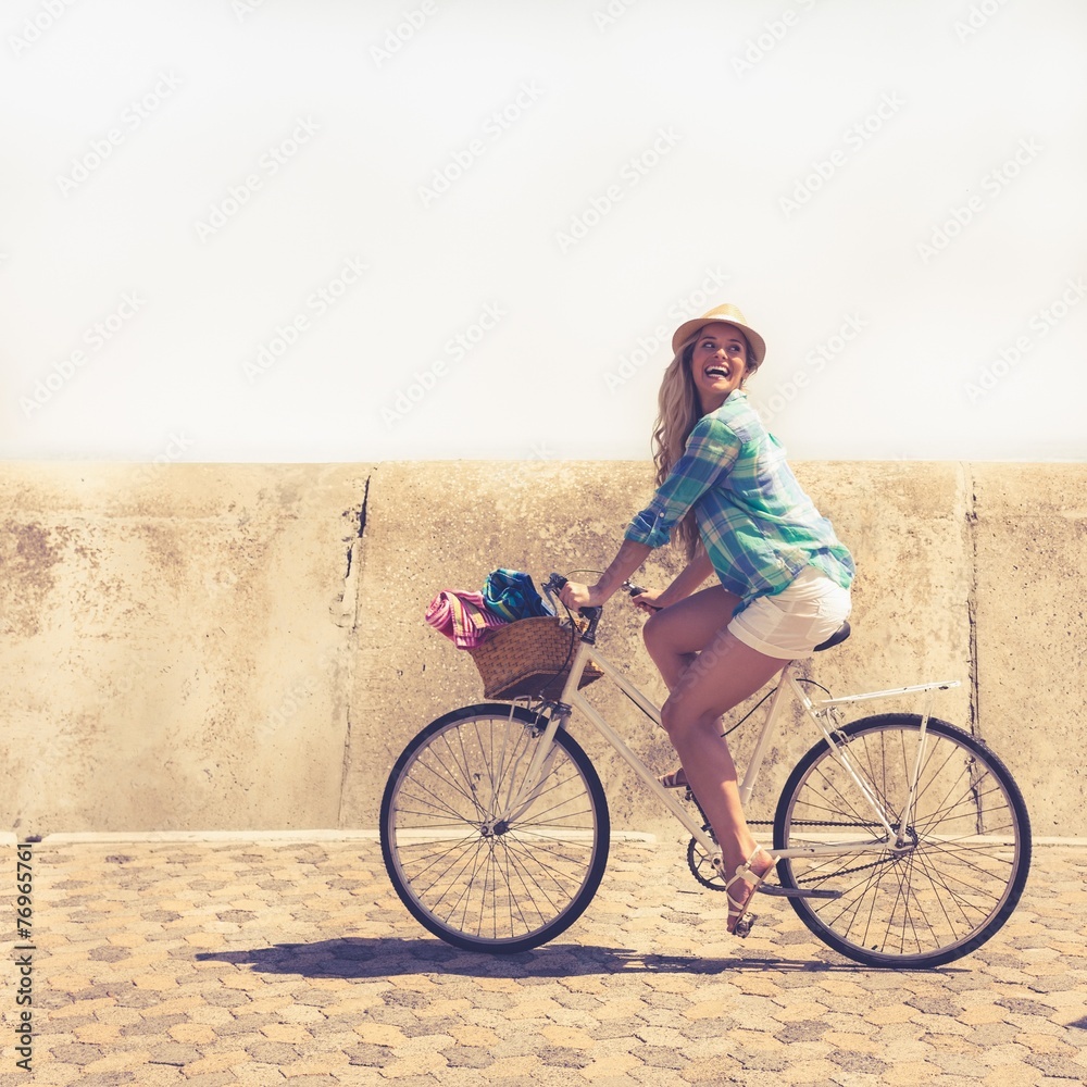 Fototapeta premium Cute blonde on a bike ride
