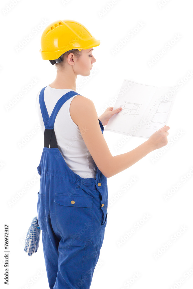 back view of woman builder in blue coveralls holding building sc back view of woman builder in blue coveralls holding building sc