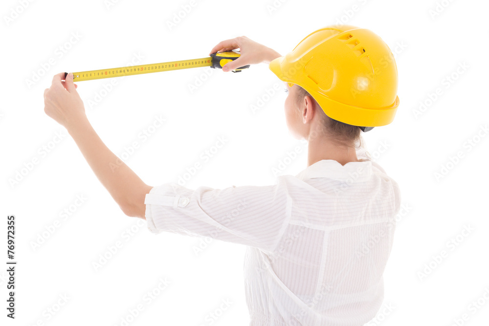 back view of business woman architect in yellow builder helmet w back view of business woman architect in yellow builder helmet w