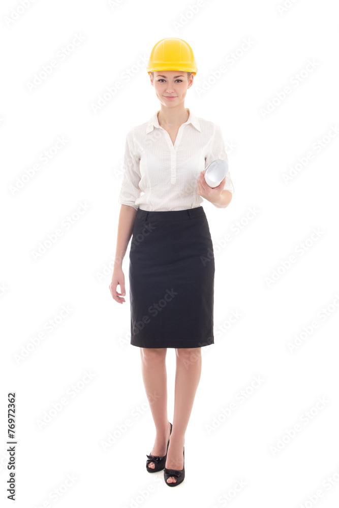 business woman architect in yellow builder helmet holding buildi