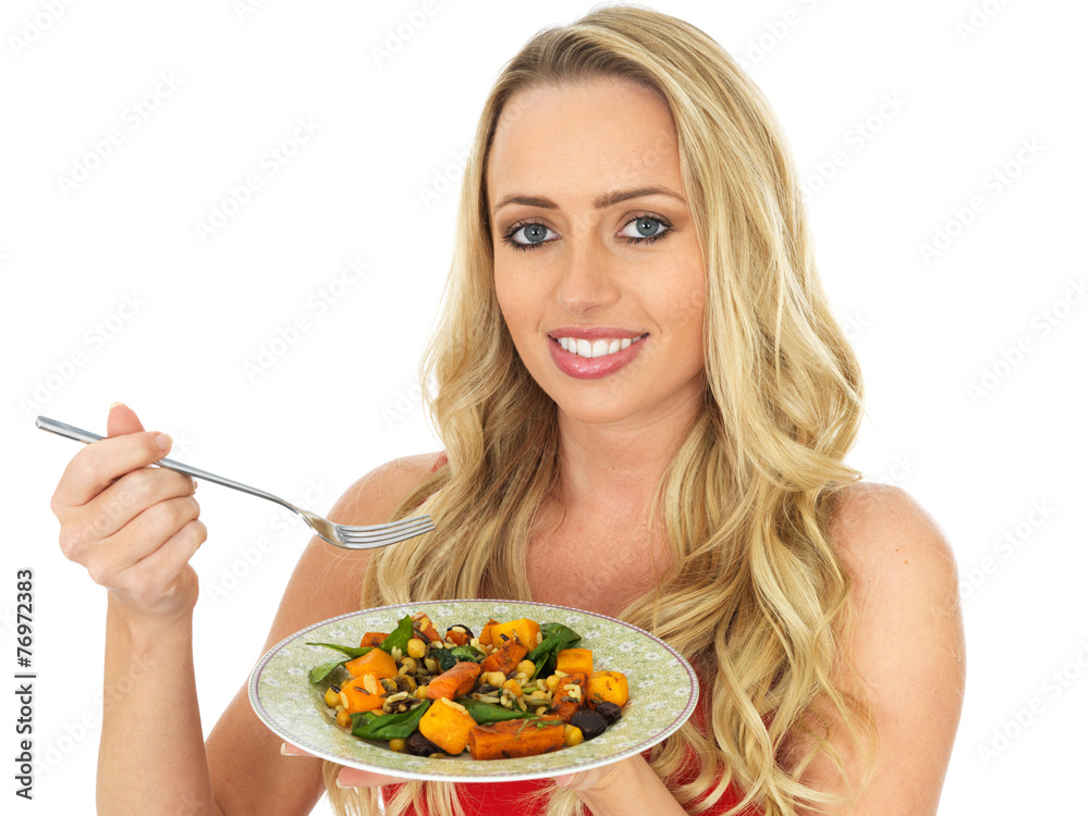 Young Woman Eating a Roast Vegetable Salad Young Woman Eating a Roast Vegetable Salad
