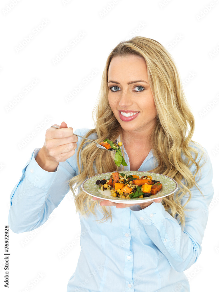 Happy Young Woman Eating a Roast Vegetable Salad Happy Young Woman Eating a Roast Vegetable Salad